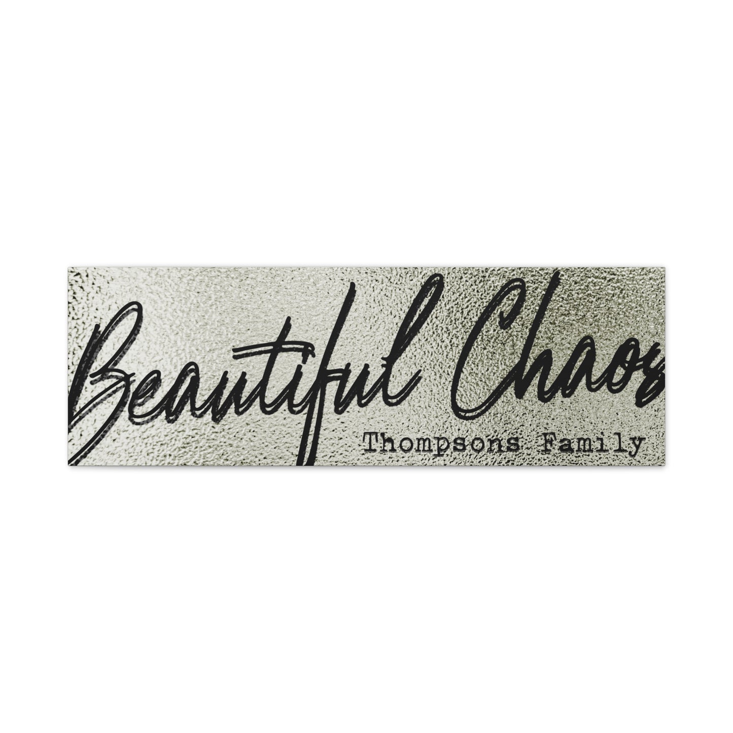 Modern minimal living room with a customized textured 'Beautiful Chaos' last name family sign on the wall against a white background front view view