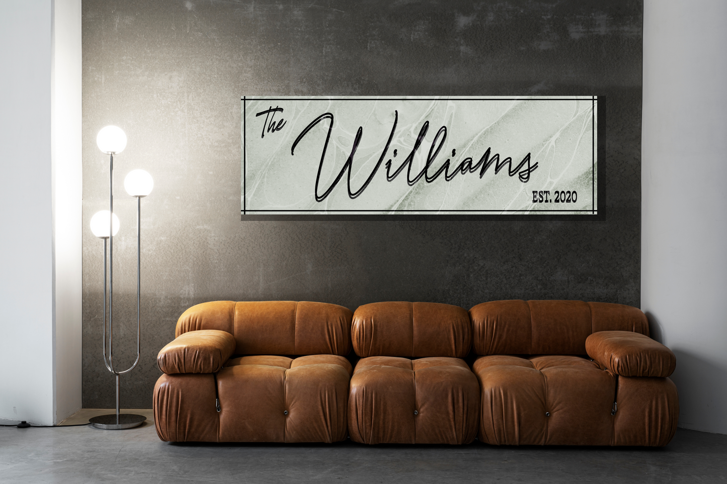 Living room with a customized and decorative textured minimal wall art displaying 'The Williams' name and year