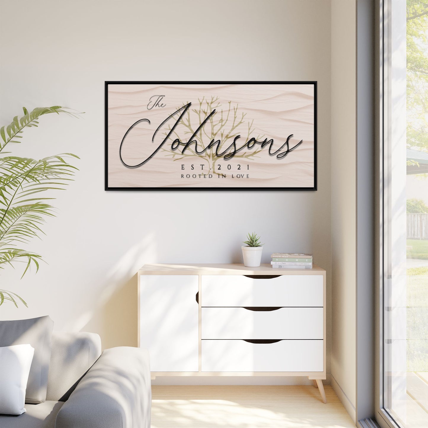 Customized Framed minimal artwork with 'The Johnsons' on a wall in a modern living room.