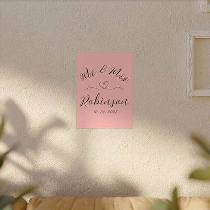 Customized minimal pink Decorative wall art with 'Mr & Mrs Robinson' on a pink background in a living room romantic gift for newly weds, anniversary and valentine's day on a living room wall